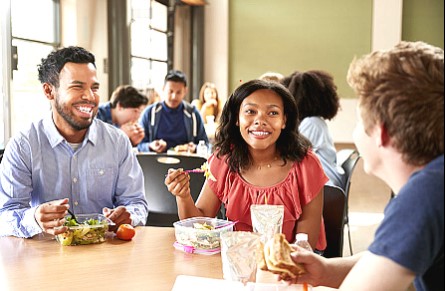 College students eating at a table